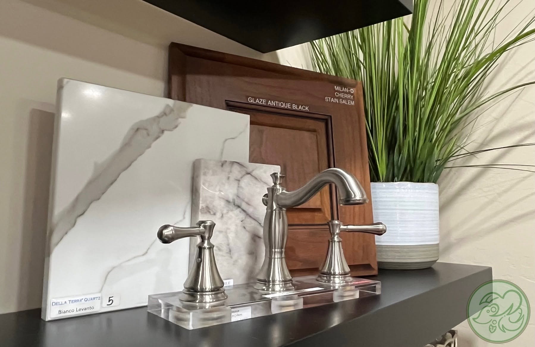 Polished faucet fixture with stone and cabinetry samples