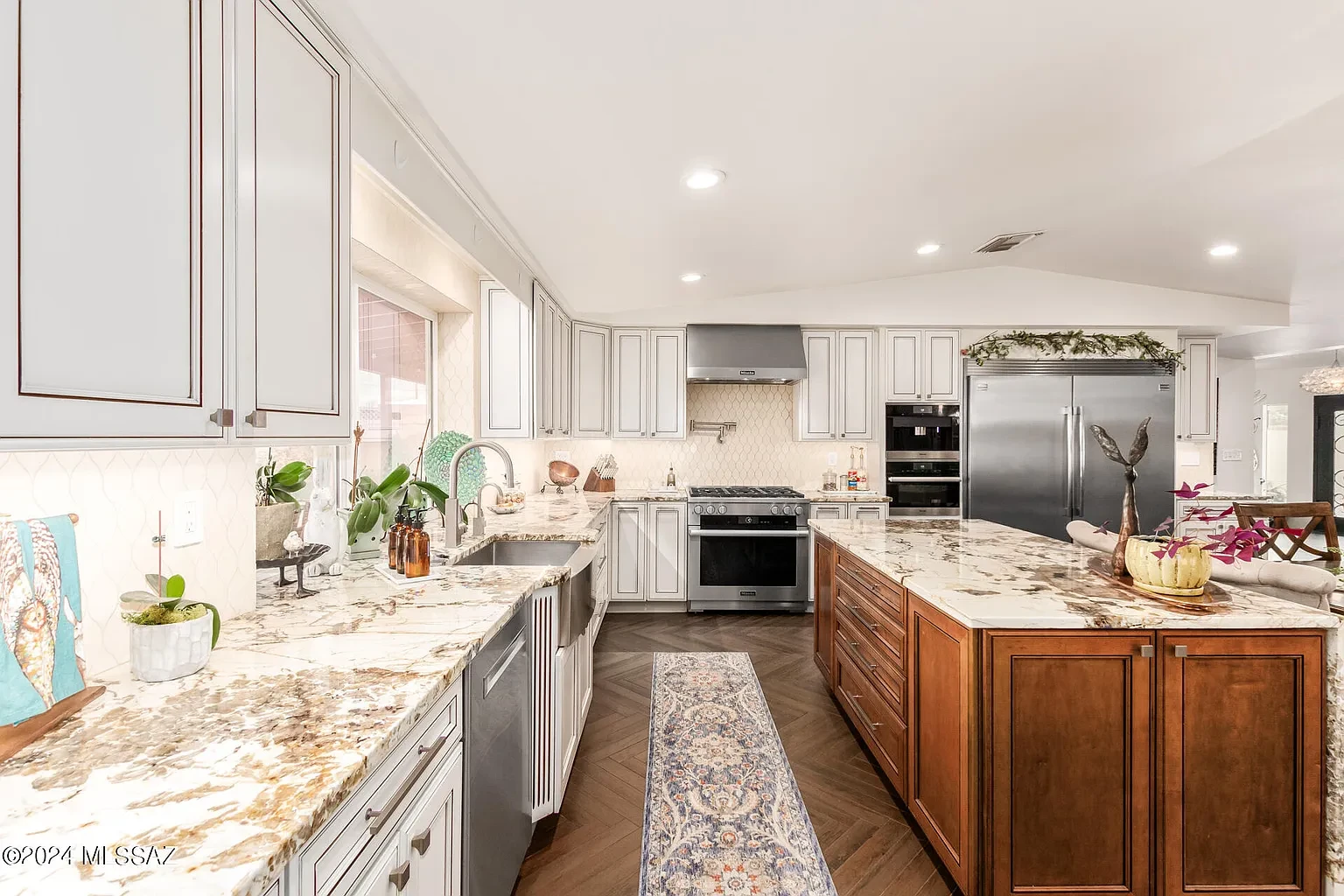 Bright Waverly kitchen with custom cabinetry and marble countertops
